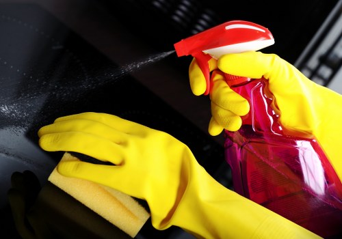 Local cleaner preparing kitchen surfaces in a Canary Wharf flat